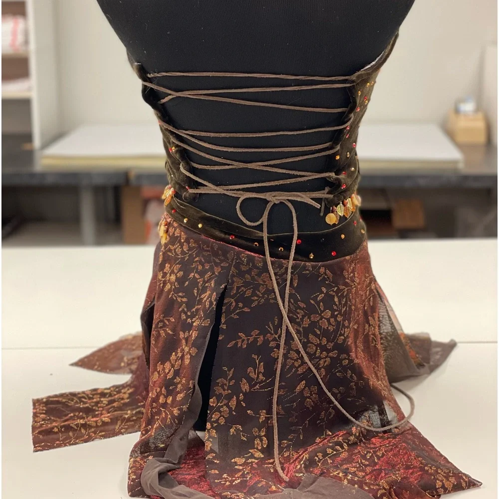 The line up brown velour dance costume rhinestones. Beaded trim.